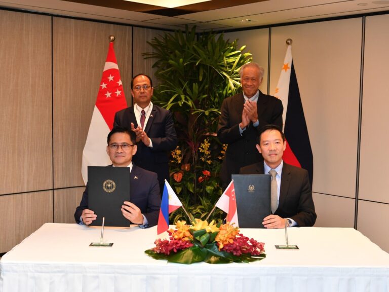 Singapore Deputy Secretary (Policy) Brigadier-General Kelvin Fan (right) and Philippines Assistant Secretary Strategic Assessment and International Affairs Pablo M. Lorenzo (left) signing the Arrangement concerning the Conduct of Education, Training Assistance and Support Activities on Humanitarian Assistance and Disaster Relief this afternoon on the sidelines of the 20th Shangri-La Dialogue. (Photo: MINDEF)