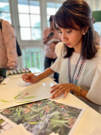 PhilBAS’ Aissa Domingo during the artist's demonstration as part of the opening of the Flora of Southeast Asia Botanical Art Exhibition in Singapore Botanic Gardens.